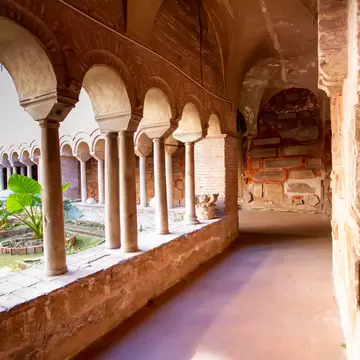 Rome, Italy- April 8,2021: The Cloister of The Basilica of San Lorenzo fuori le Mura.A square corridor built in the 12th century,Numerous sarcophagi and bas-reliefs are arranged along the walls; Shutterstock ID 1954131592; purchase_order: 65050; j...