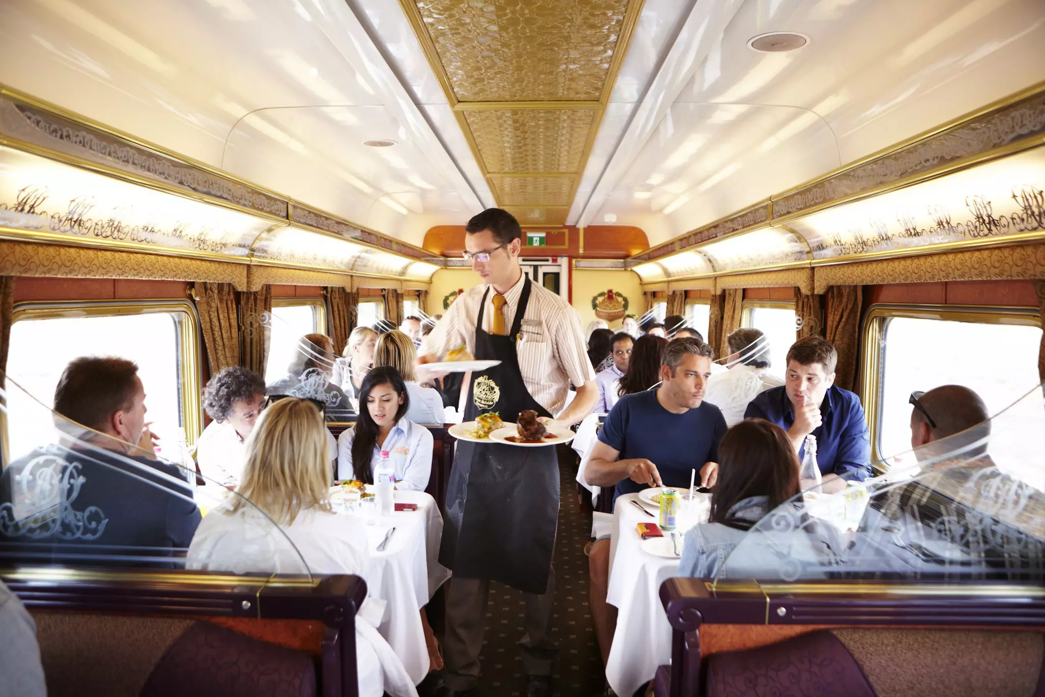 Lunch is served to Gold and Platinum Service passengers in the Queen Adelaide Restaurant Car onboard the Indian Pacific train.