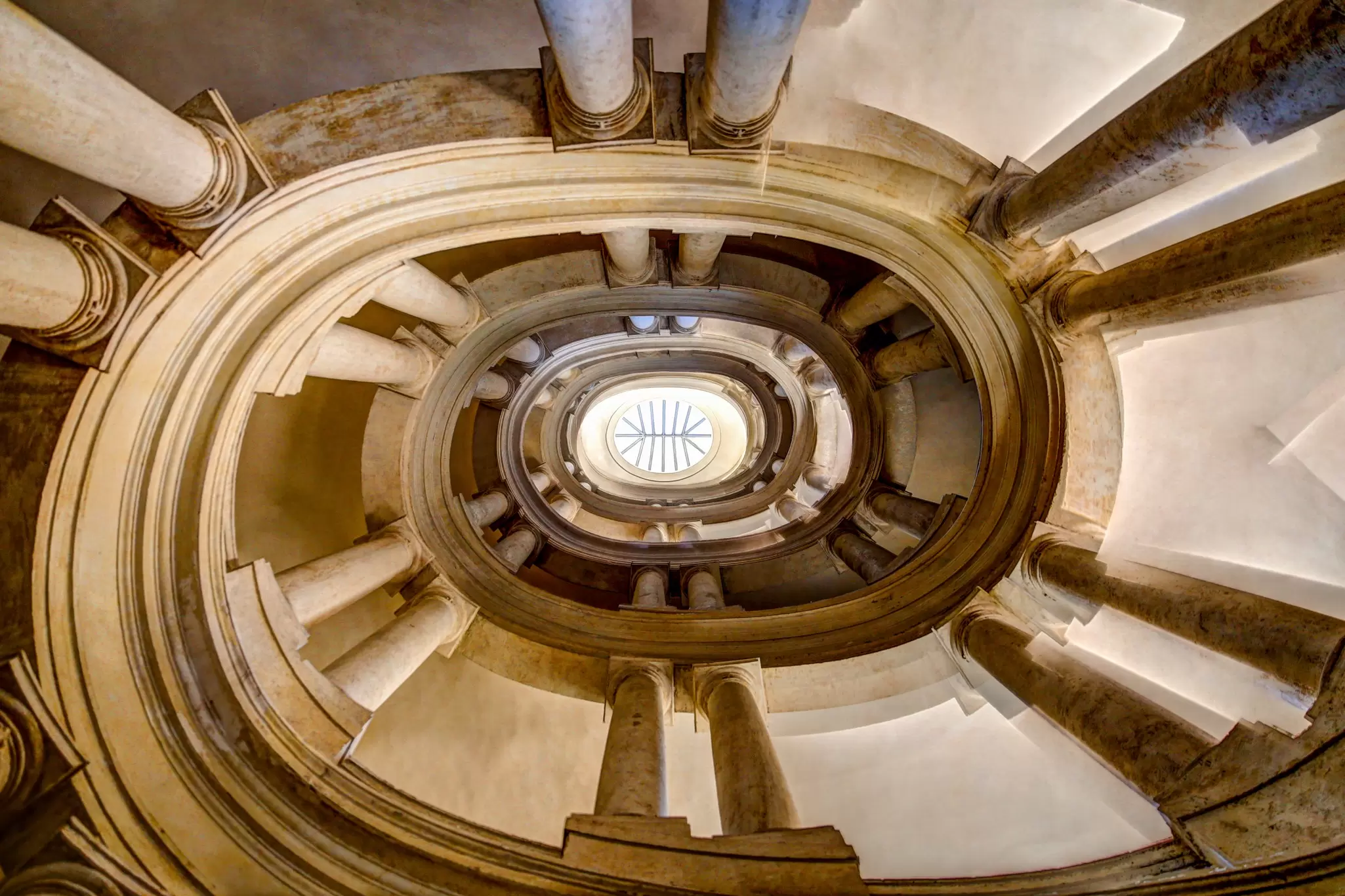 View of the Borromini Staircase of the Palazzo Barberini from below in Rome, Italy.