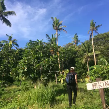 Hiking a trail in Fiji. chameleonseye/Getty Images