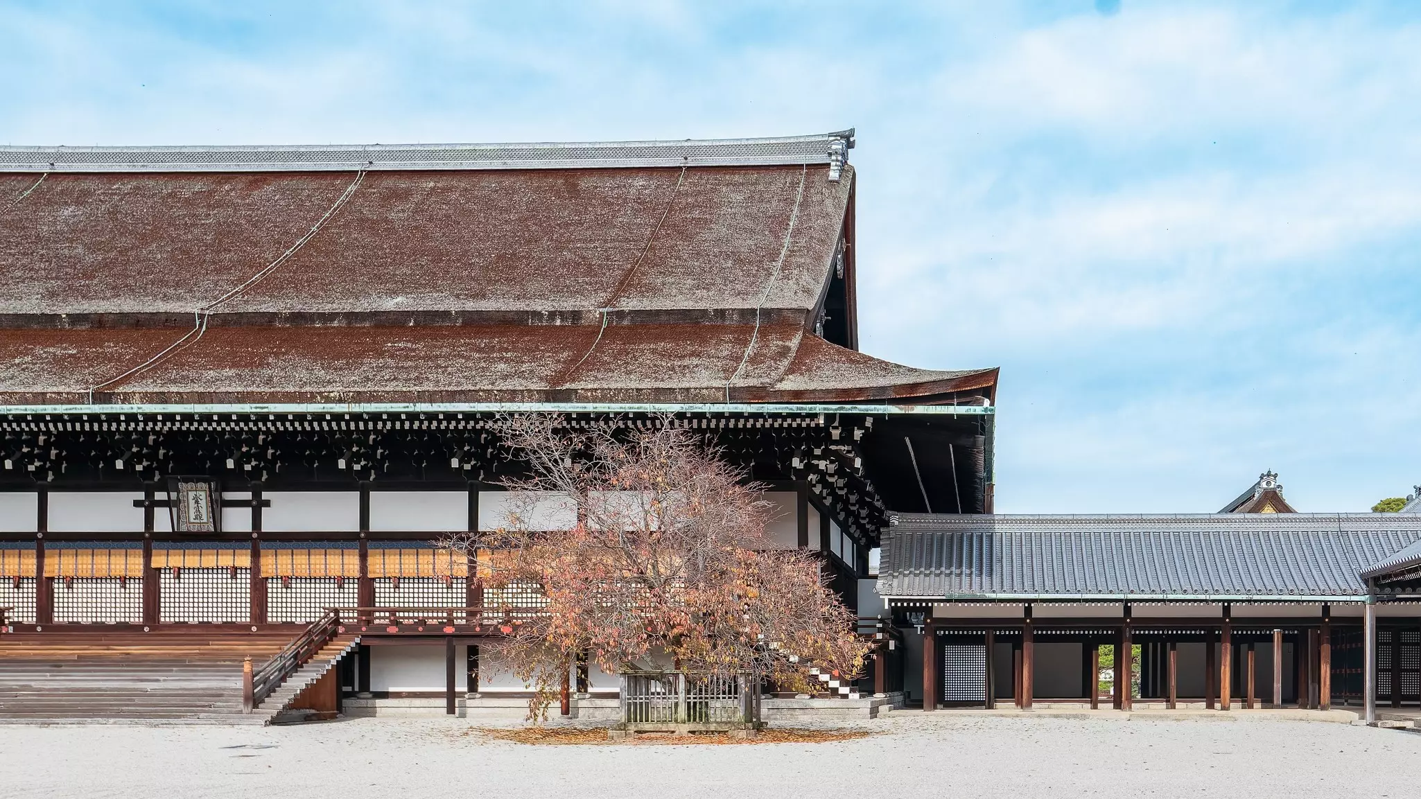 A large traditional structure in Japan in autumn.