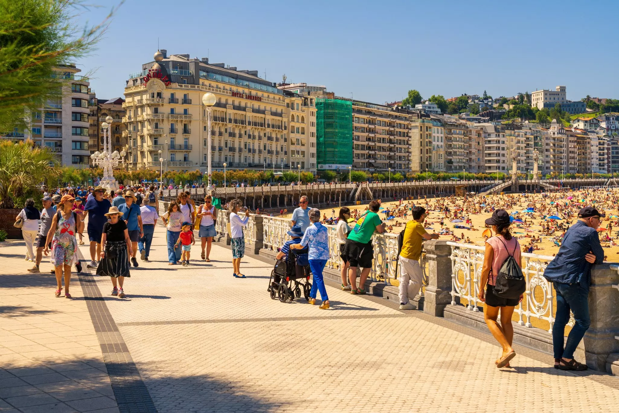 San Sebastian, Spain in June. View of the famous promenade along La Concha beach in San Sebastian, Spain.