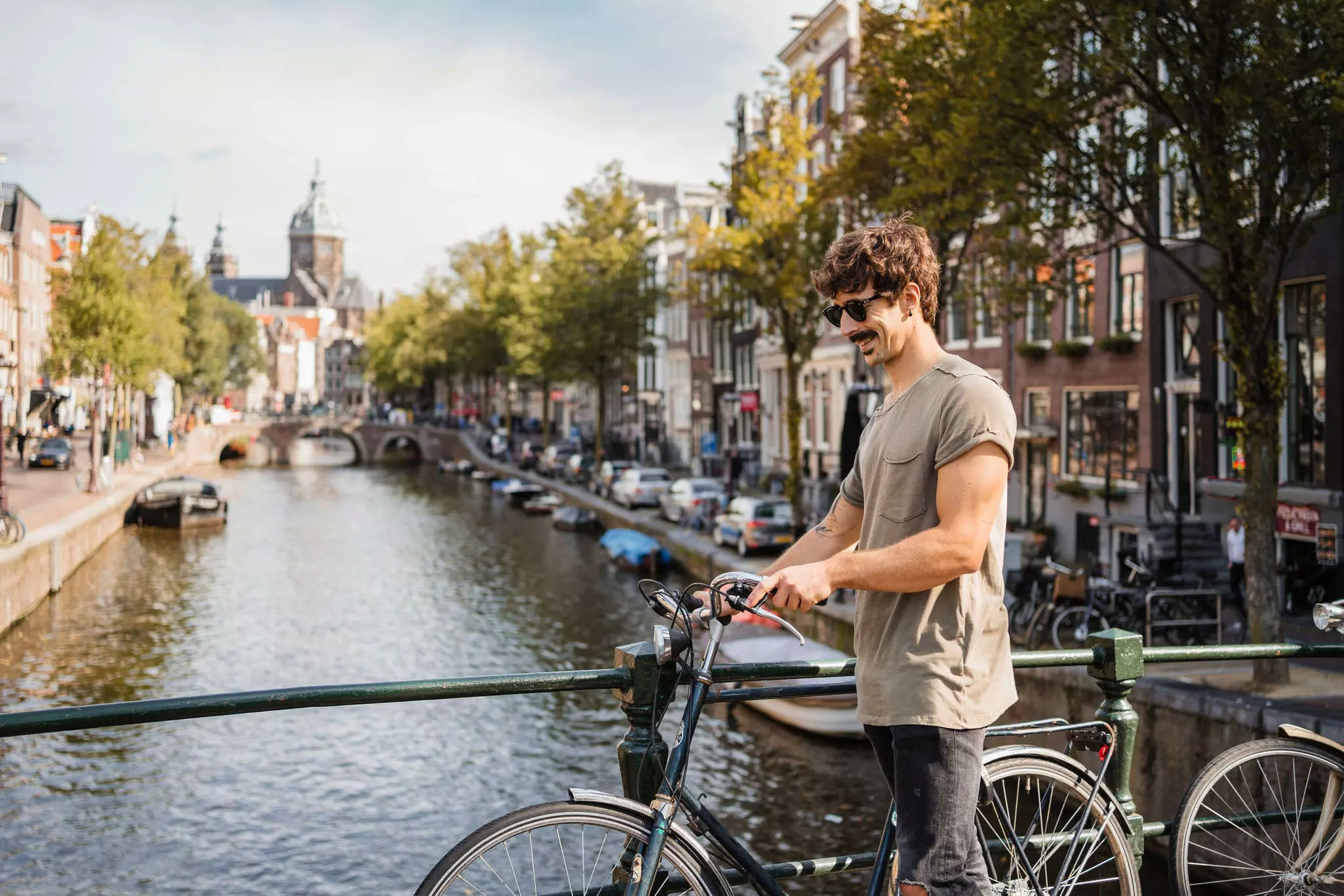 Man riding bike through Amsterdam.