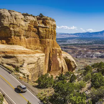 With hairpin turns, high altitude summits and stunning vistas, Colorado’s road trips are as fun as they are beautiful. Thomas Roche/Getty Images