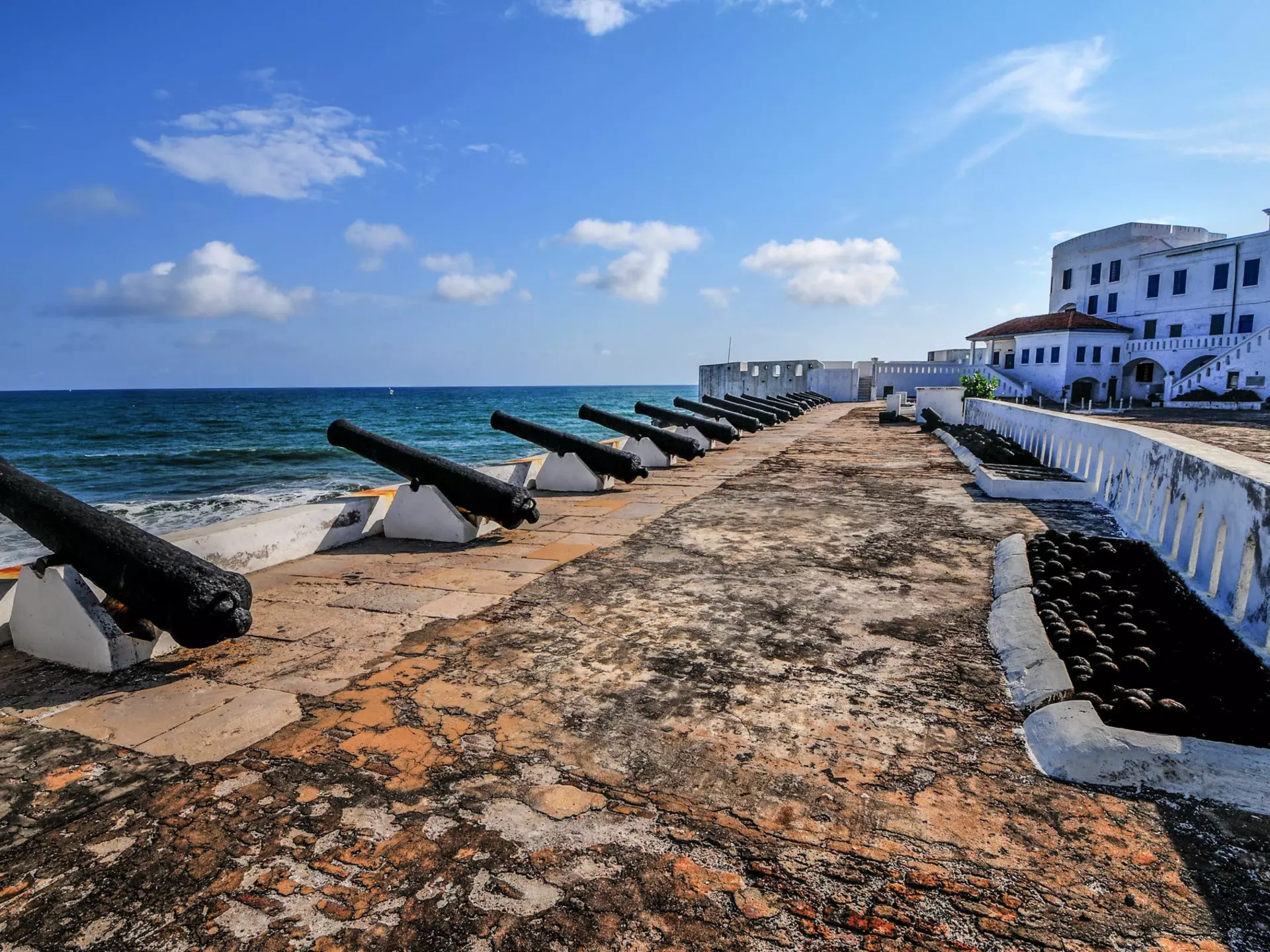 Cannons overlooking from Cape Coast Castle, a fortification in Ghana built by Swedish traders for trade in timber and gold. Later the structure was used in the trans-Atlantic slave trade.
144162838
africa, african culture, african descent, antique, architecture and buildings, atlantic ocean, beach, black, bodies of water, cannon, cape, castle, coast, coastline, concepts and ideas, dutch culture, elmina, fort, fortified wall, ghana, guinea, gun, history, iron, looking at view, military, nature, netherlands, nobody, old, old-fashioned, people, portuguese culture, prison, rock, rust, rusty, scenics, sea, sky, slavery, tourism, tower, town, trading, traditional culture, travel, travel destinations, white
