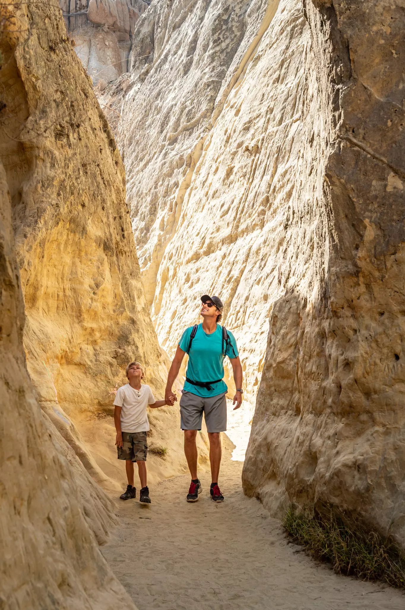 Dad and Son Hiking in a Canyon