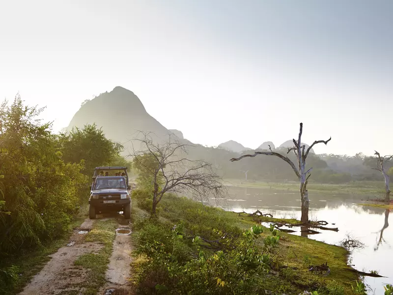 Jeep passing waterhole.
Great Escapes, Sri Lanka, Lonely Planet Traveller Magazine, Issue 81, September