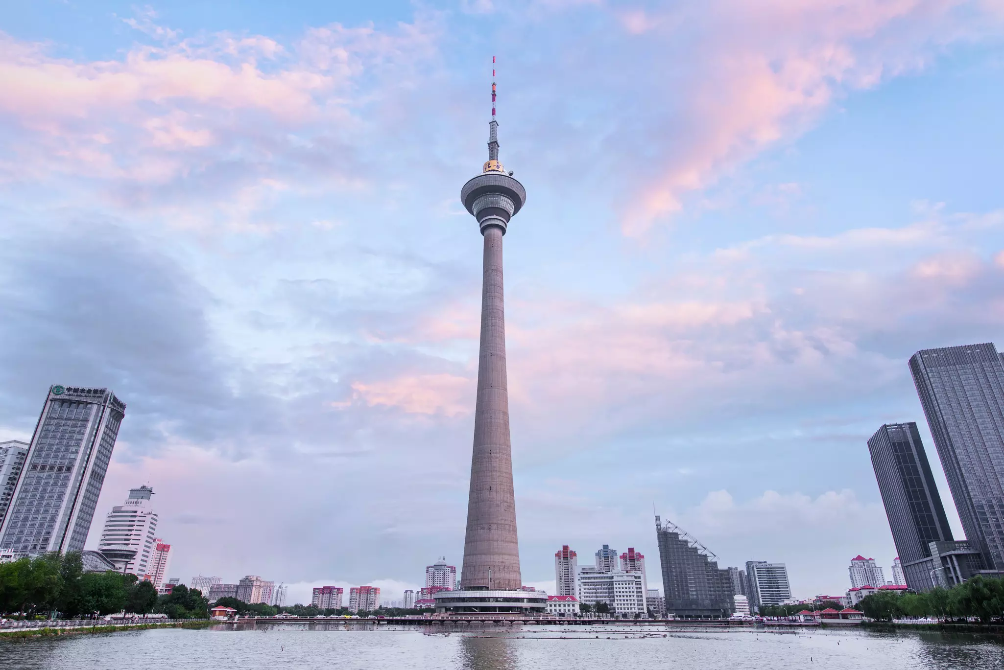 The imposing Tianjin Radio and Television Tower in Tianjin China, viewed across the water.