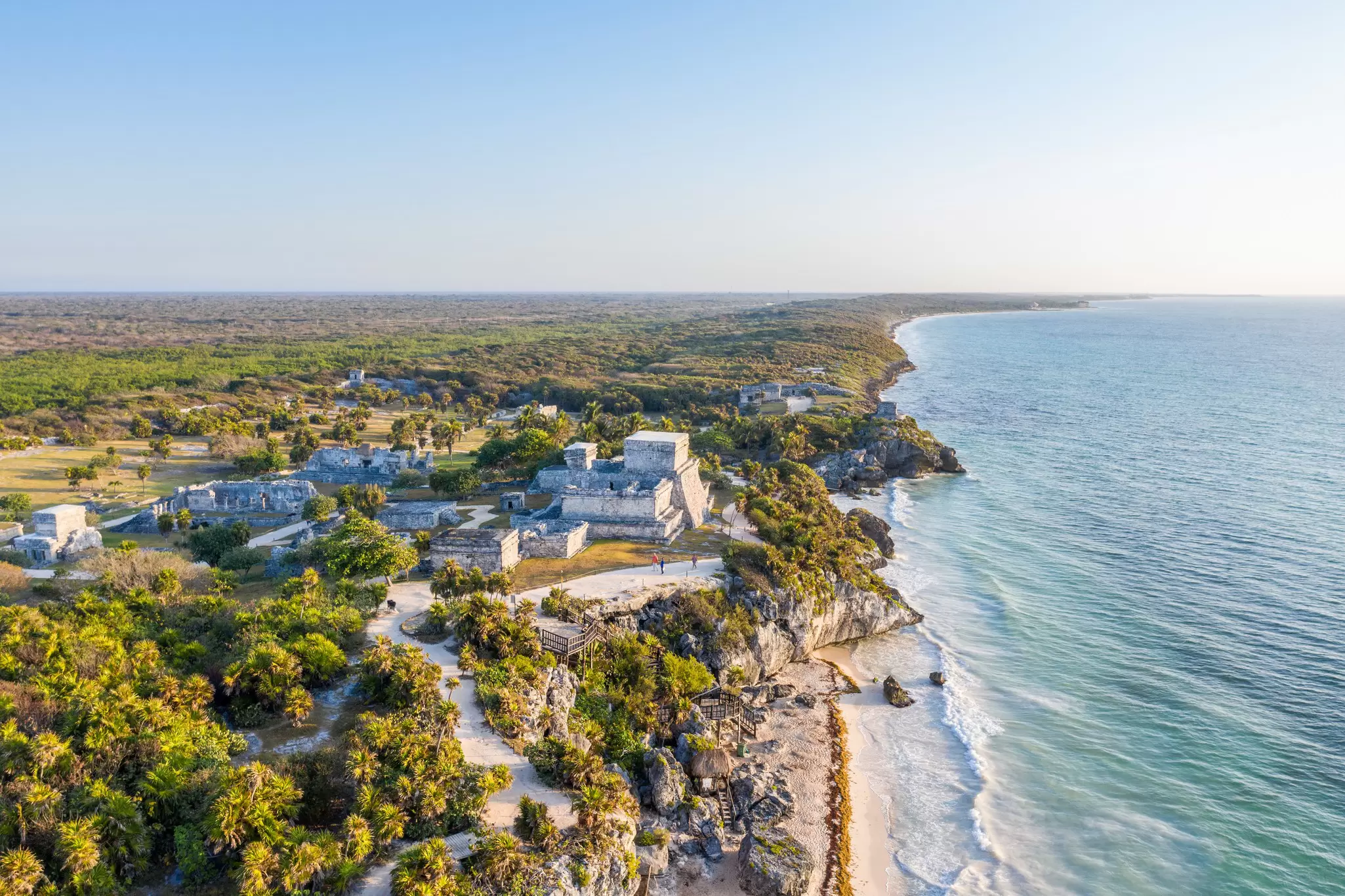 Aerial view of the archaeological zone of Parque del Jaguar in Mexico, with the sea on the side.