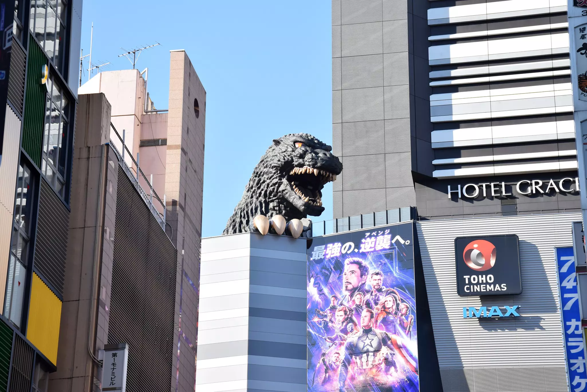 Heart of Shinjuku area, with close up of Godzilla towering over buildings
