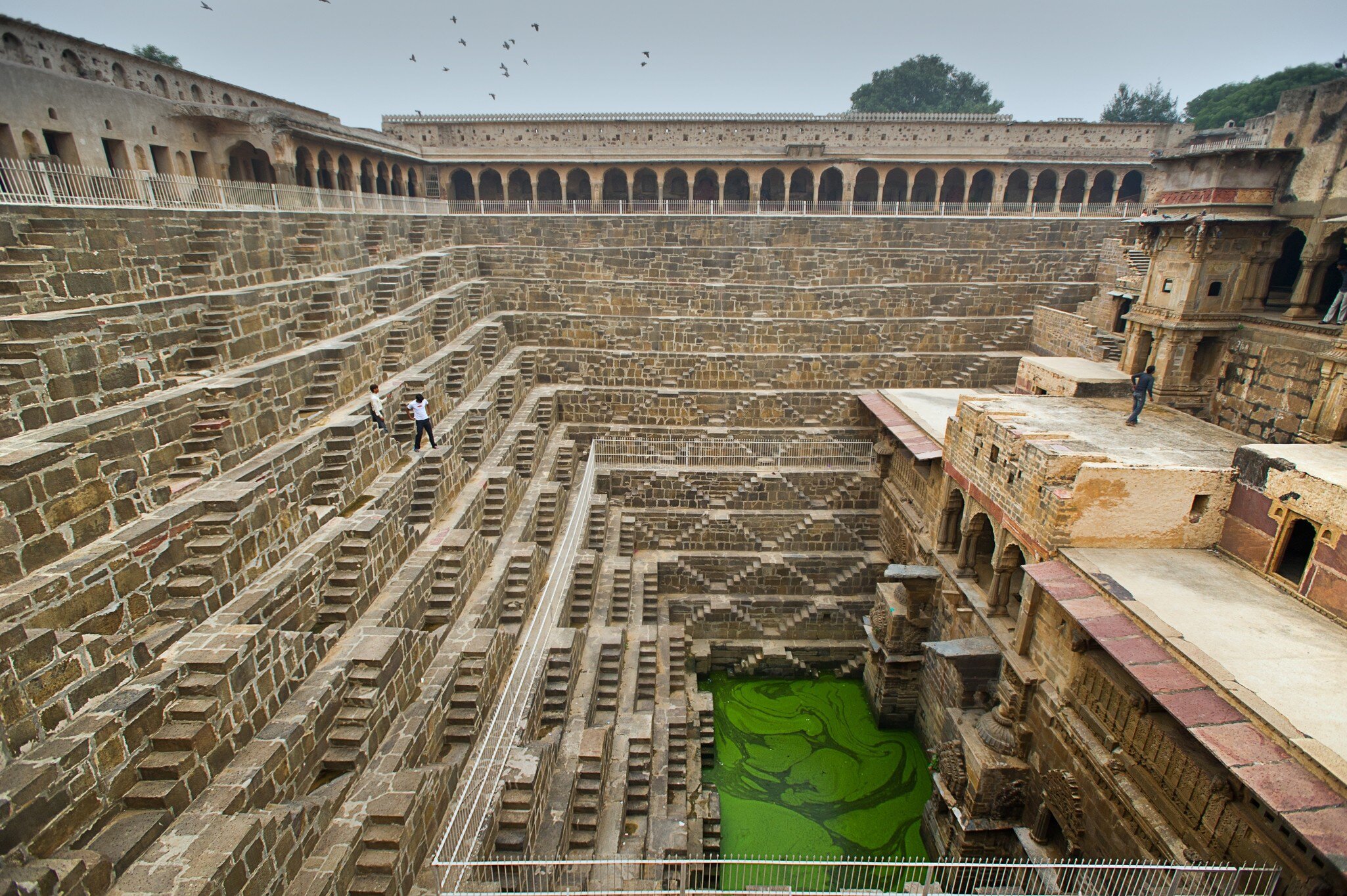 Chand Baori, an ancient stepwell located in Abhaneri, Rajasthan, India. Known for its intricate symmetrical steps and historical architecture.
