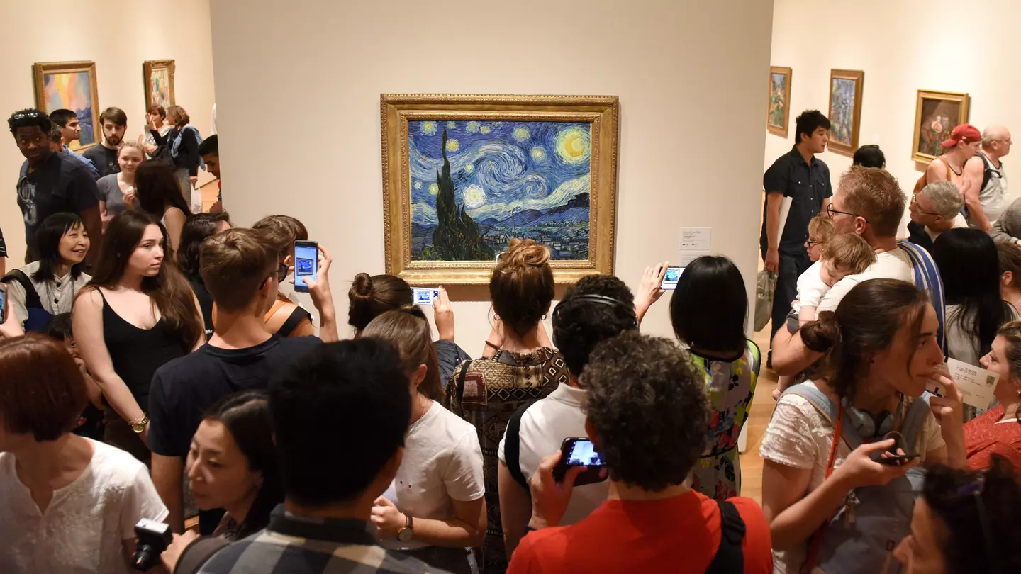 May 25, 2018: Crowd of people surround the Starry Night painting by Vincent van Gogh inside the Museum of Modern Art.