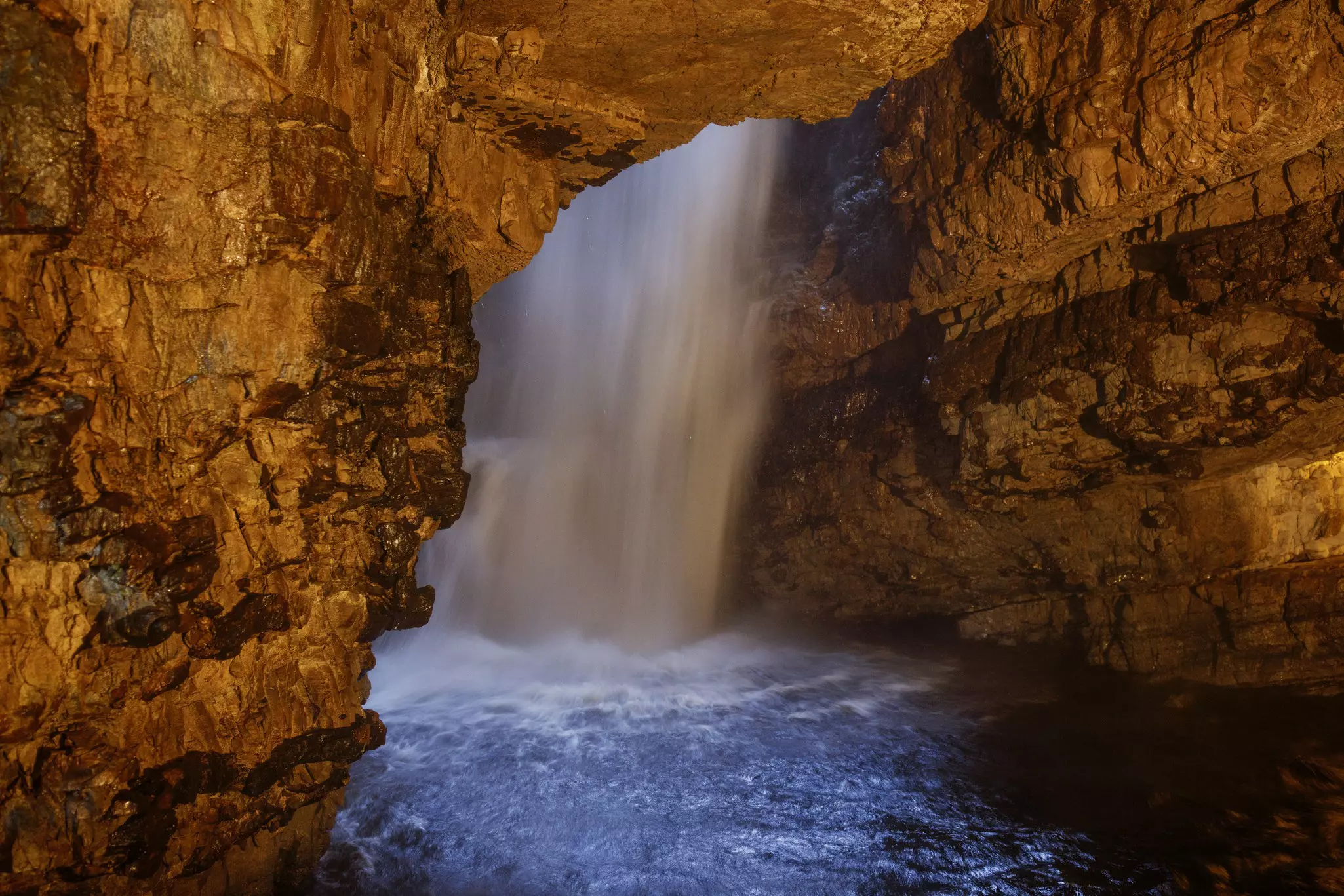 Water pouring inside Smoo Cave in Durness