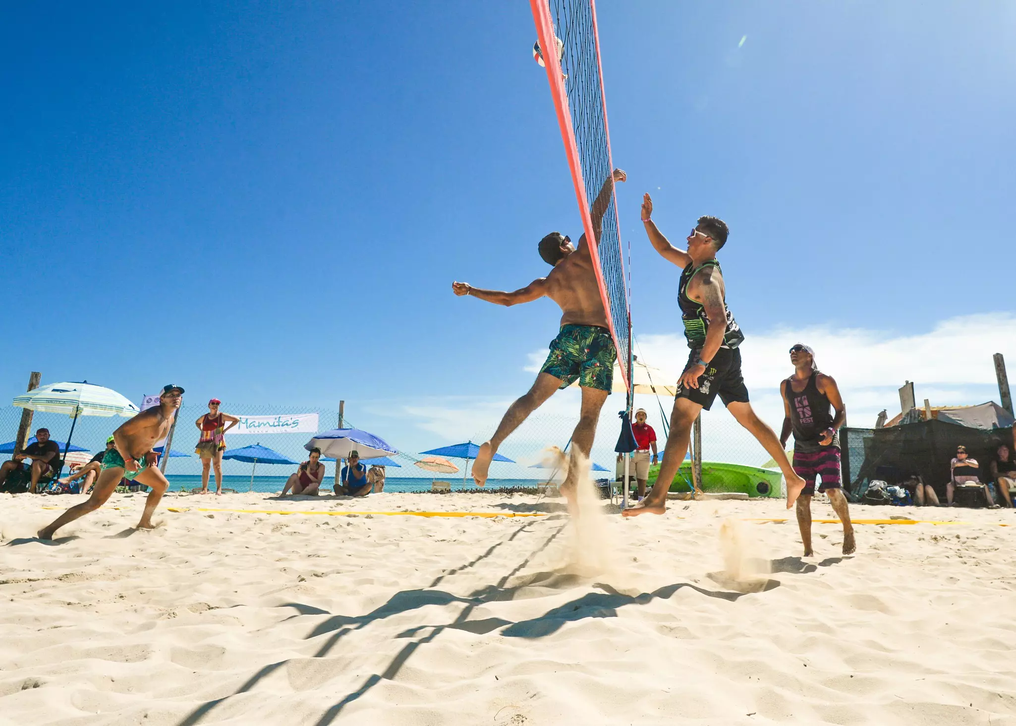 People playing beach volleyball in Playa Del Carmen. 