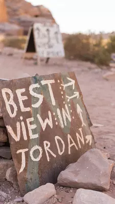 a handpainted sign with the words Best View in Jordan painted on it