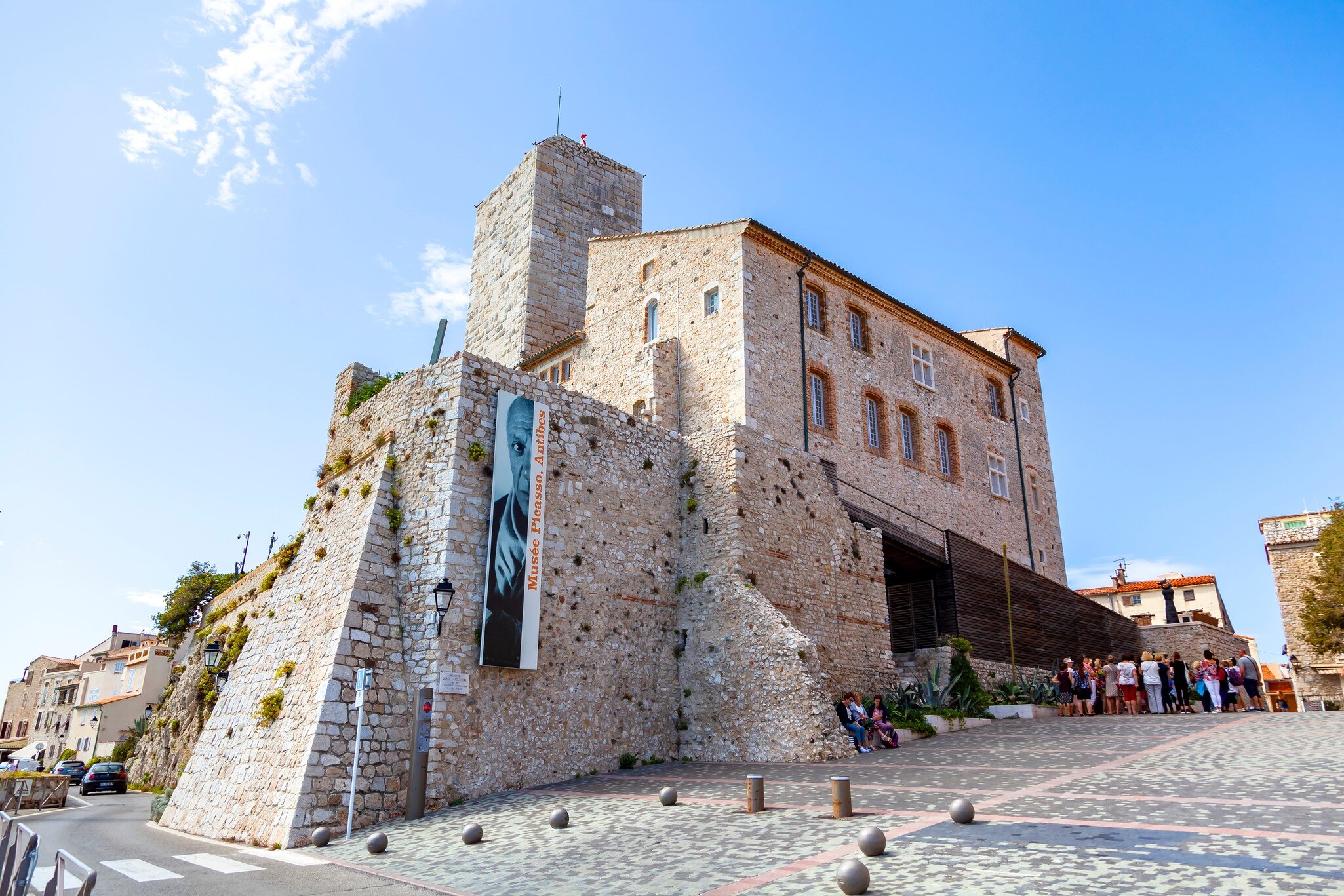 ANTIBES, FRANCE - September 25, 2019: Grimaldi Castle facade  in Antibes, France. Grimaldi Castle shelter the Picasso Museum, where are exposed paintings and ceramics of Pablo Picasso; Shutterstock ID 1524290699;