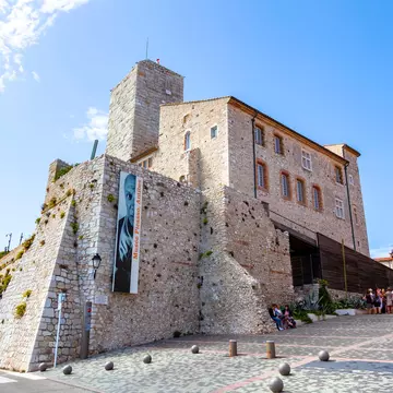 ANTIBES, FRANCE - September 25, 2019: Grimaldi Castle facade  in Antibes, France. Grimaldi Castle shelter the Picasso Museum, where are exposed paintings and ceramics of Pablo Picasso; Shutterstock ID 1524290699;