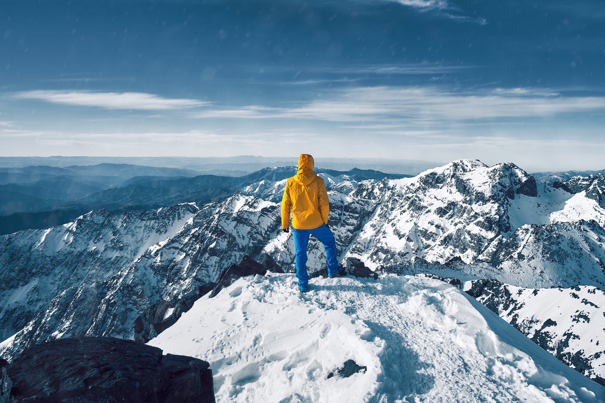 Reaching the top of North Africa on the summit of Toubkal in Morocco's High Atlas Mountains. Lukas Hodon / Shutterstock