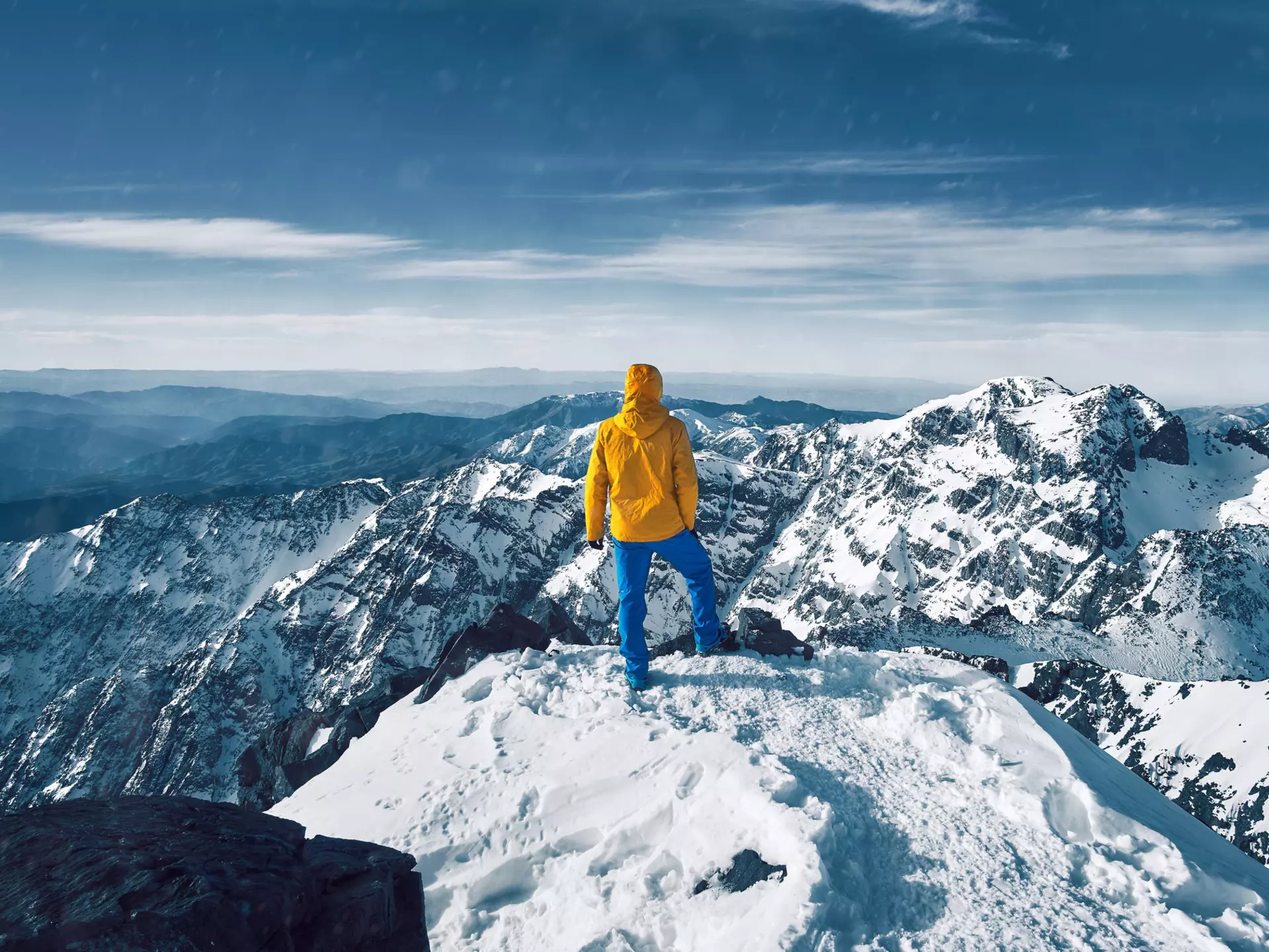 Reaching the top of North Africa on the summit of Toubkal in Morocco's High Atlas Mountains. Lukas Hodon / Shutterstock