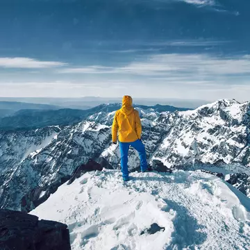 Reaching the top of North Africa on the summit of Toubkal in Morocco's High Atlas Mountains. Lukas Hodon / Shutterstock