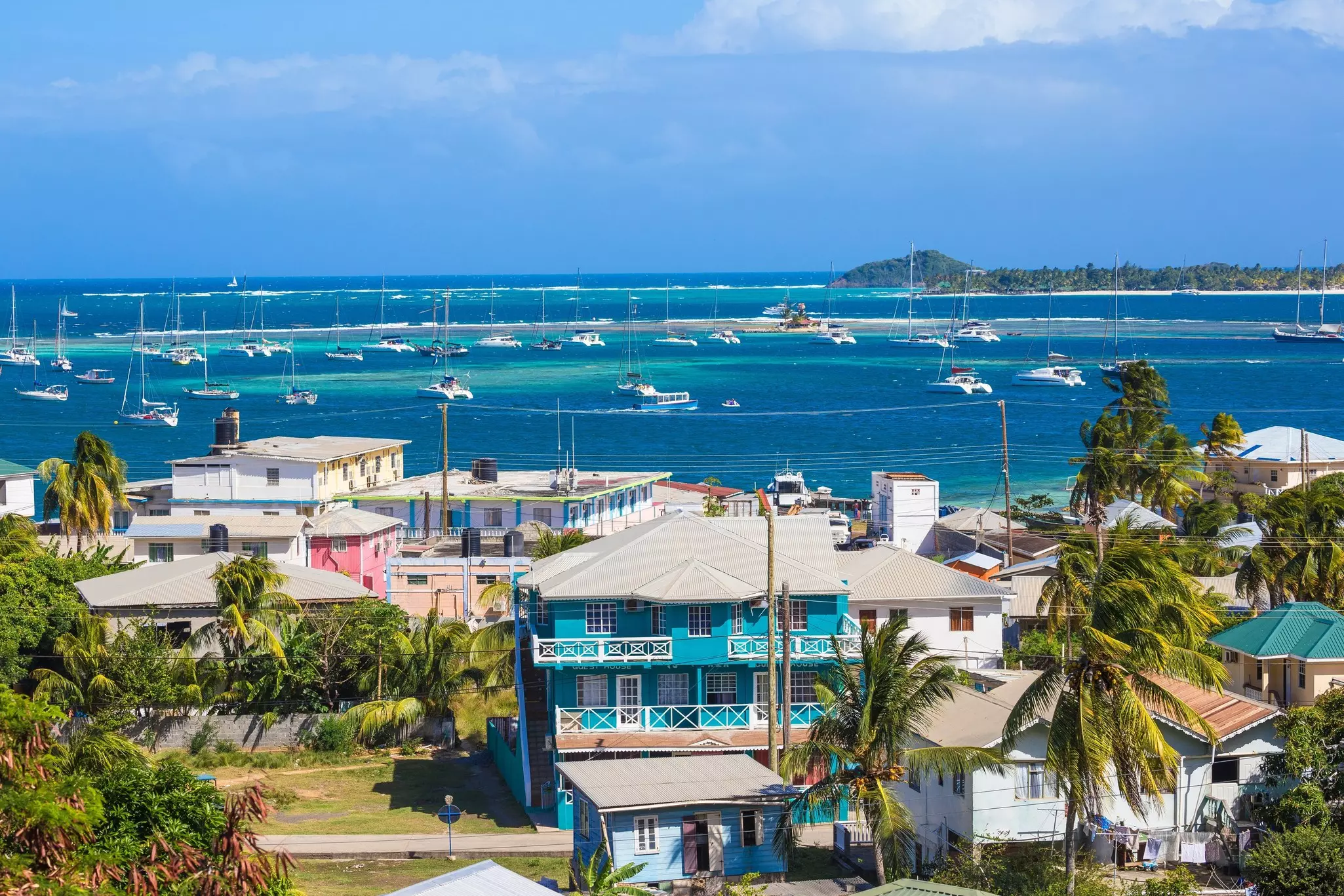 View of Clifton and Clifton harbour, Union Island, with Palm Island in the distance, The Grenadines, St. Vincent and The Grenadines
