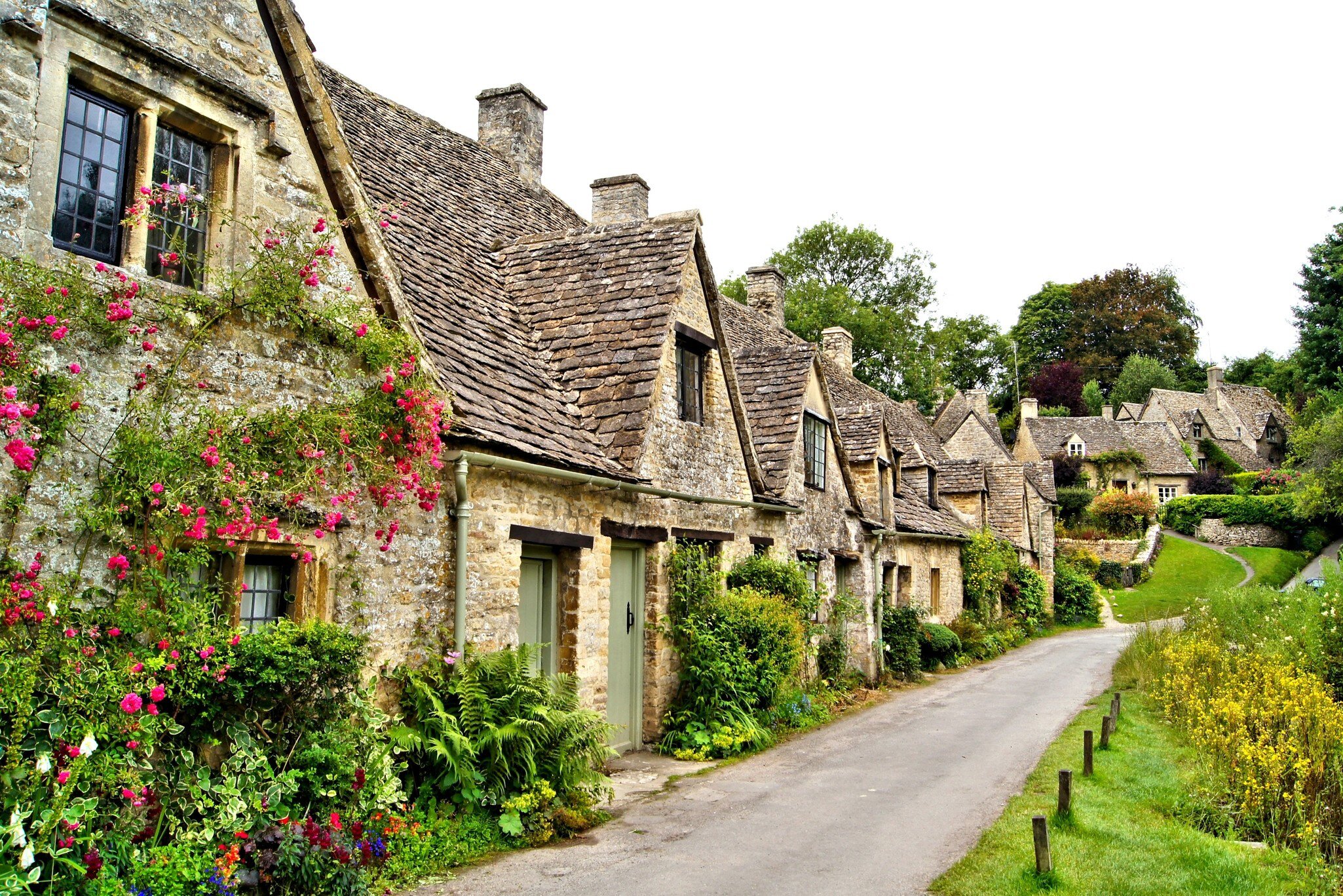 Houses of Arlington Row in the village of Bibury, England; Shutterstock ID 172701119; your: Sloane Tucker; gl: 65050; netsuite: Online Editorial; full: Cotswolds Things to Do article