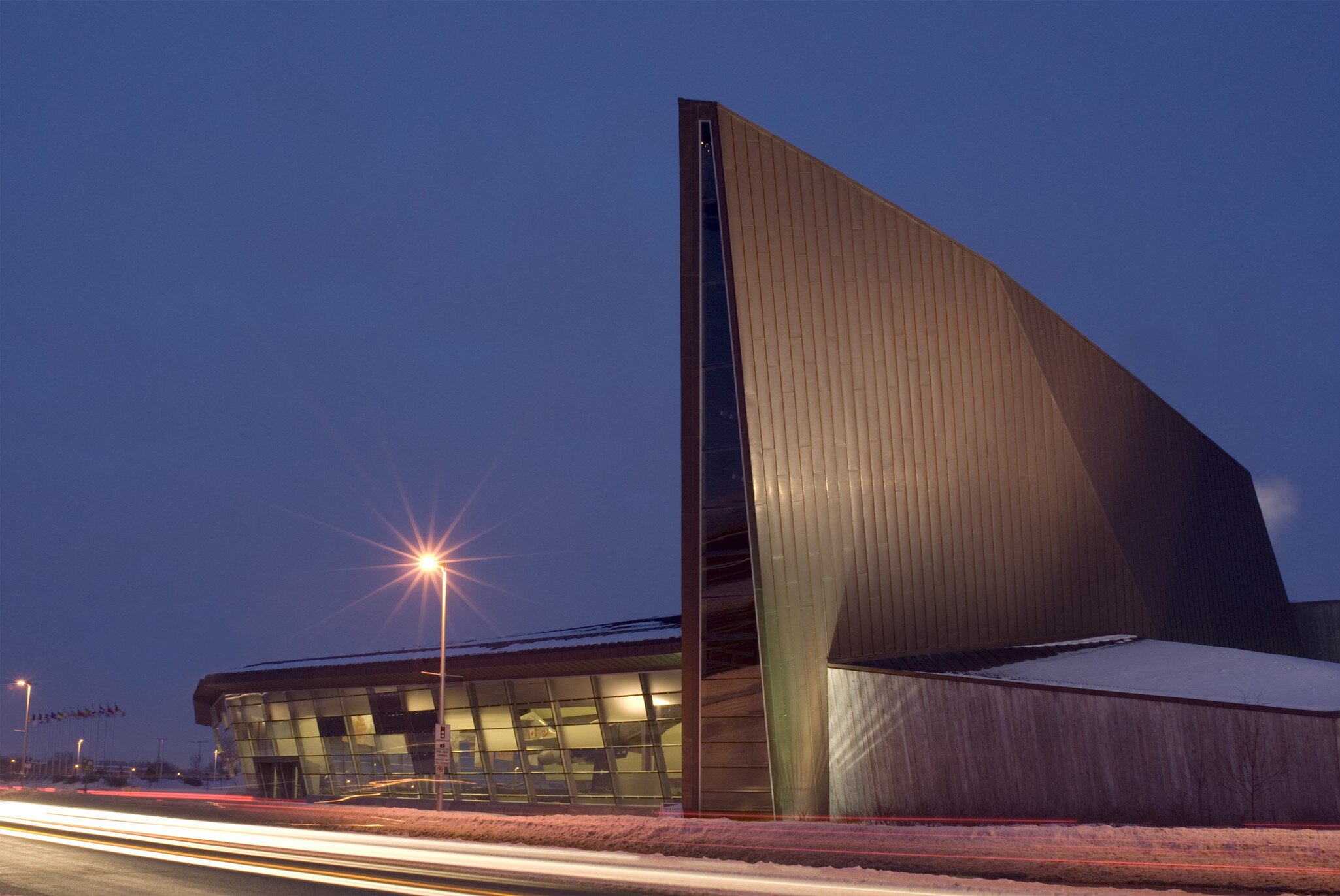 A winter night shot of the Canadian War Museum in Ottawa.
9236116
architecture, awe, blakeley, blur, building, canada, canadian, capital, city, cold, contemporary, copper, dark, destination, dramatic, facade, famous, federal, flag, front, futuristic, government, history, horizontal, illuminated, landmark, light, majestic, modern, motion, museum, national, new, night, ontario, ottawa, place, power, public, scene, sky, snow, tourism, travel, urban, vacation, war, winter