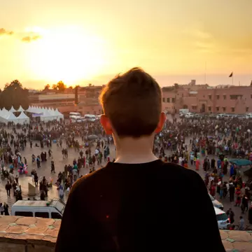 567350311
2015; Africa; Architecture; Photography; Rear View; Crowd; Djemma El Fna Square; Dusk; Large Group Of People; Males; Outdoors; People; Built Structure; Child; Children Only; High Angle View; Marrakesh; Marrakesh-Tensift-El Haouz; Morocco; Mosque; Travel Destinations; City Life; Color Image; Horizontal; Incidental People; One Boy Only; One Person; Standing; Sunset;
Boy looking out onto Jemaa el Fna square in Marrakech, Morocco at sunset.