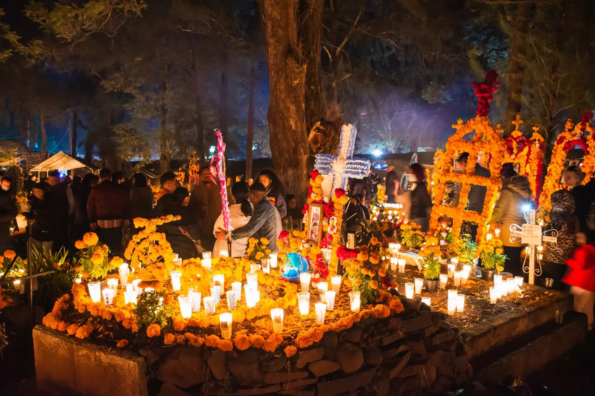 Floral decorations for Día de Muertos at a cemetery in Michoacán, Mexico.