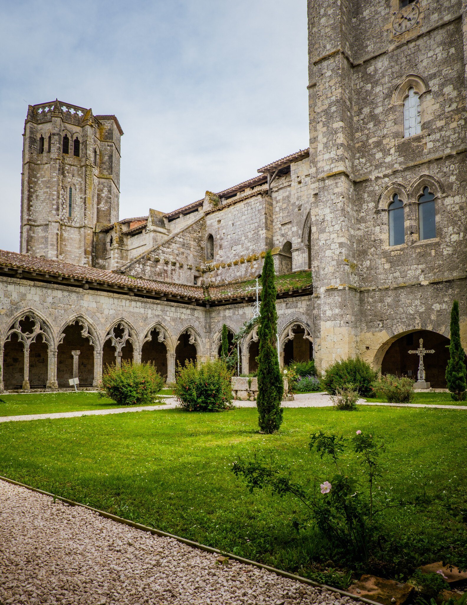 The medieval cloister and tower of the Saint Pierre collegial church in La Romieu, south of France (Gers). 