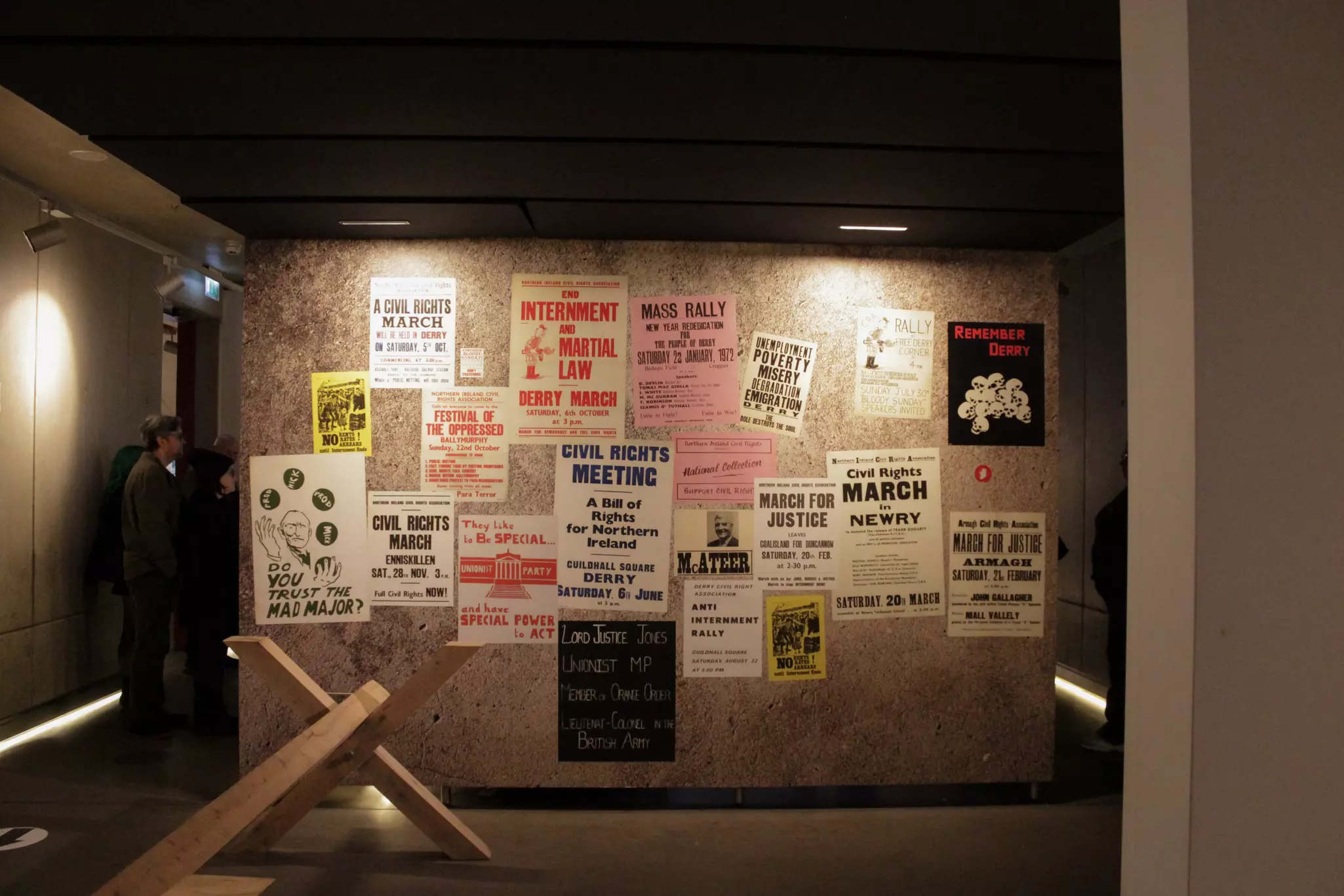 Flyers on a wall in a museum.