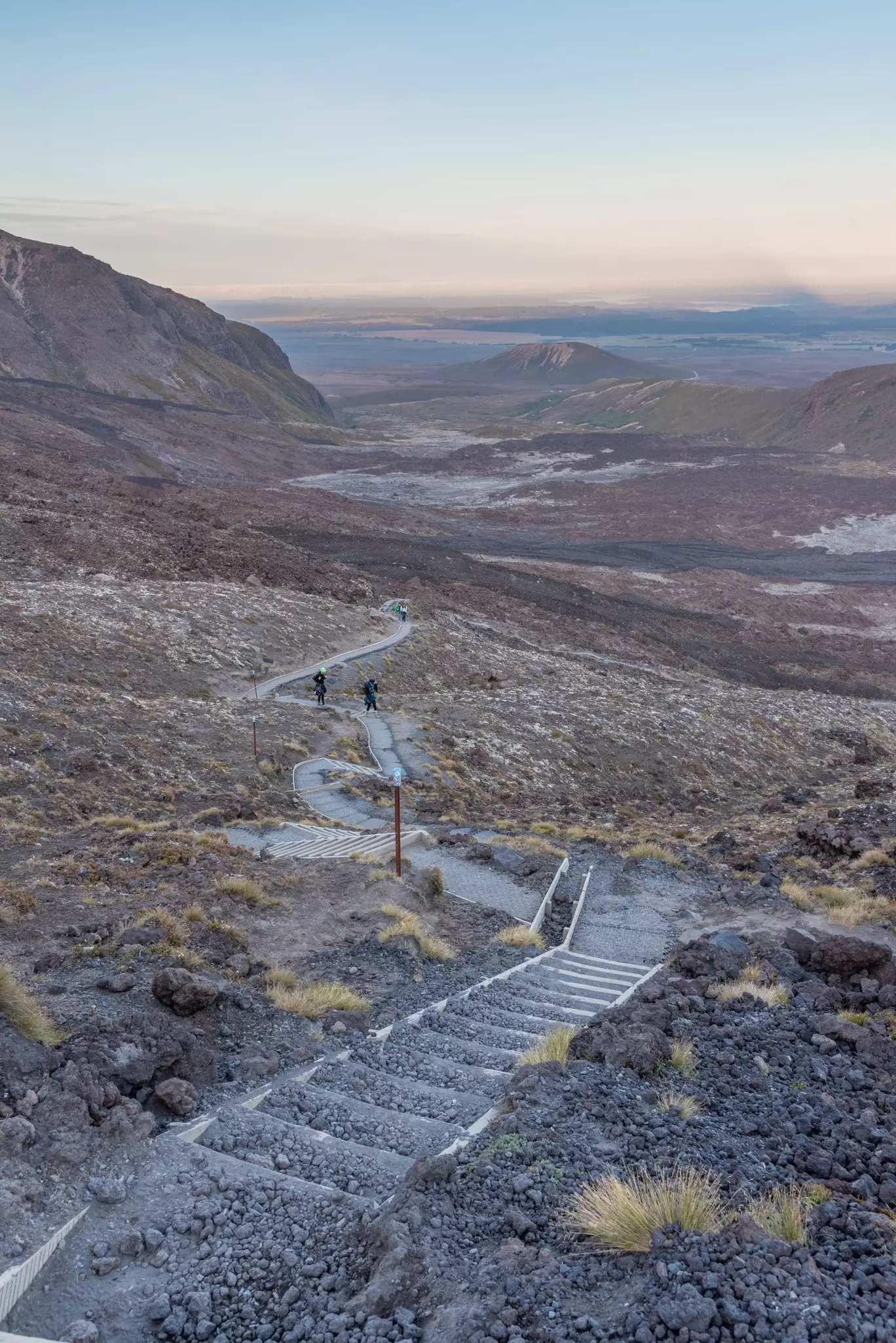 A steep staircase in a lava field leading down over undulating land