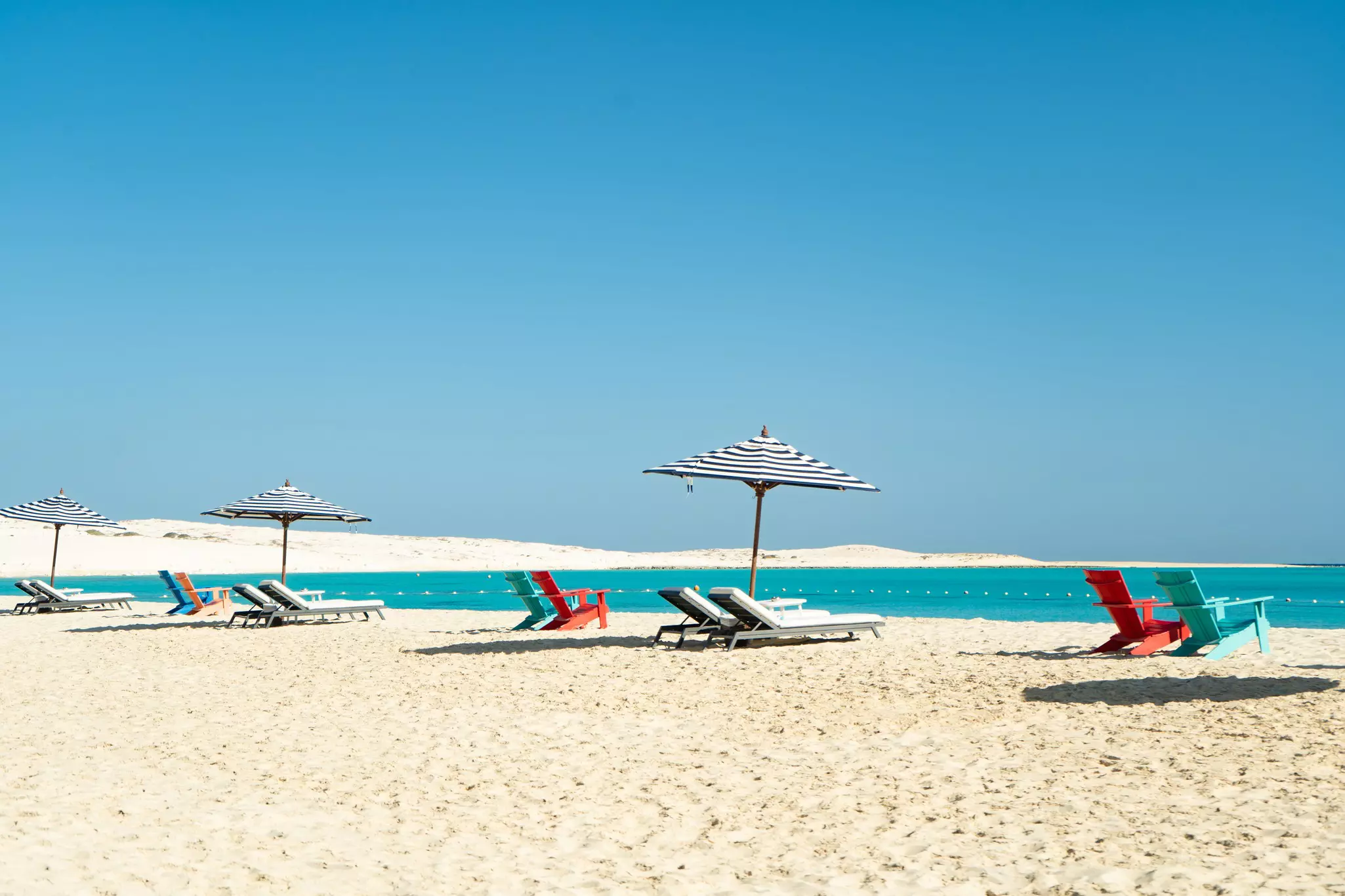 Bright white sand on the beach at El Alamein, Egypt.