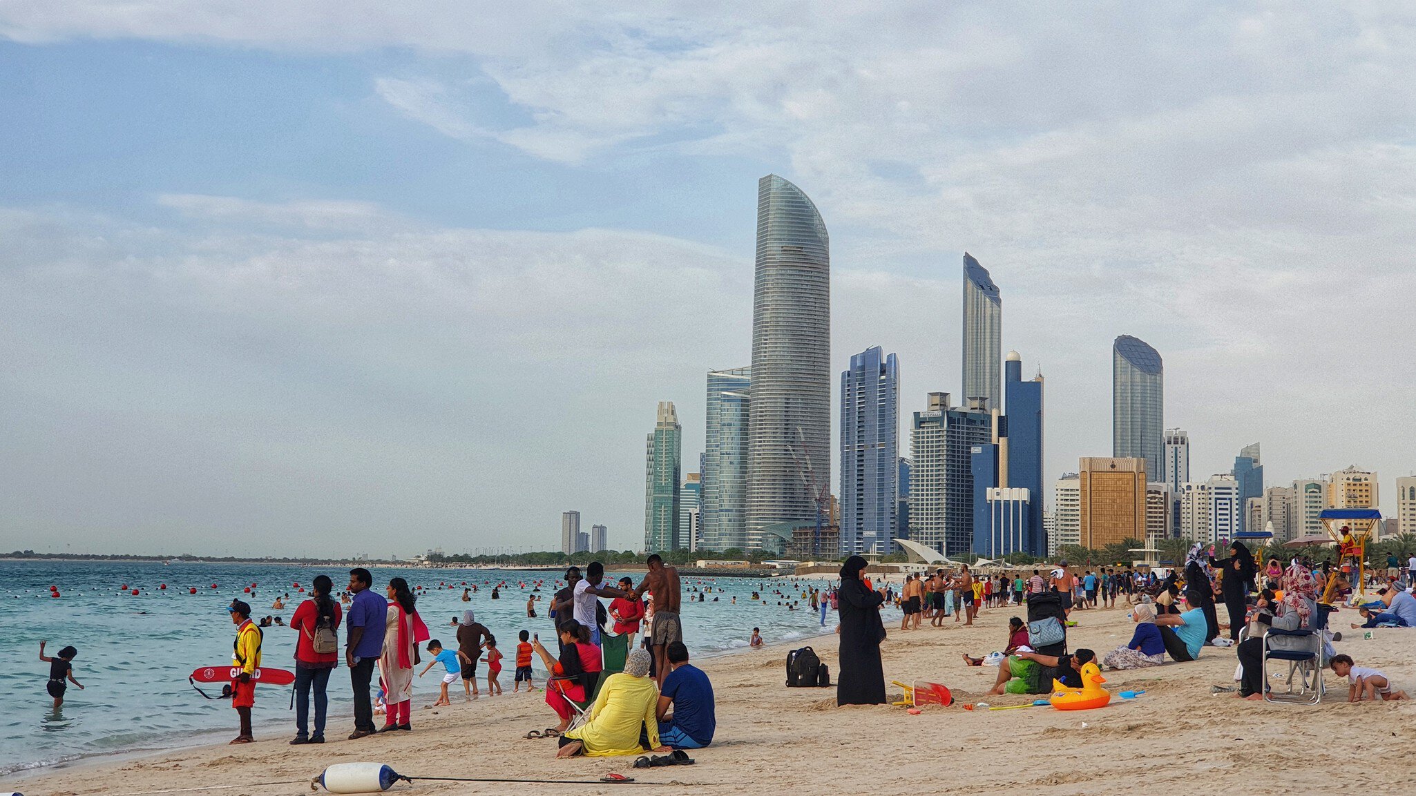 April 5, 2019 - Abu Dhabi, UAE: Residents of Abu Dhabi enjoying and swimming at corniche beach, Abu Dhabi.  License Type: media  Download Time: 2024-01-25T15:30:14.000Z  User: clairenaylor  Is Editorial: Yes  purchase_order:   