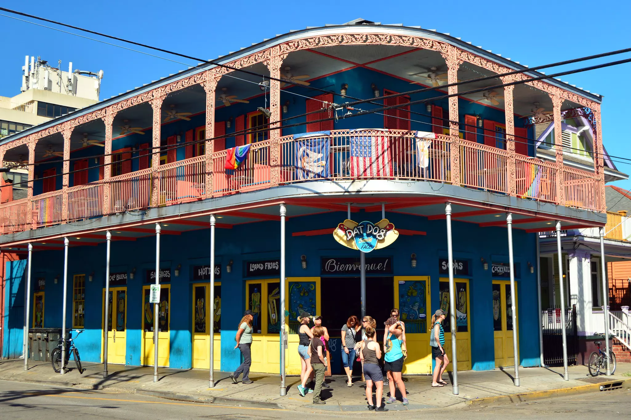 A group of young adults gather outside a tavern on Frenchman Street, in the Faubourg Marigny neighborhood of New Orleans