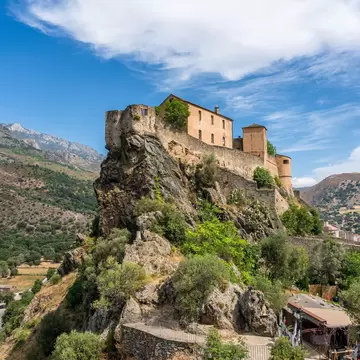 The beautiful little town of Corte overlooked by its Citadel, on a summer morning, Corsica, France.