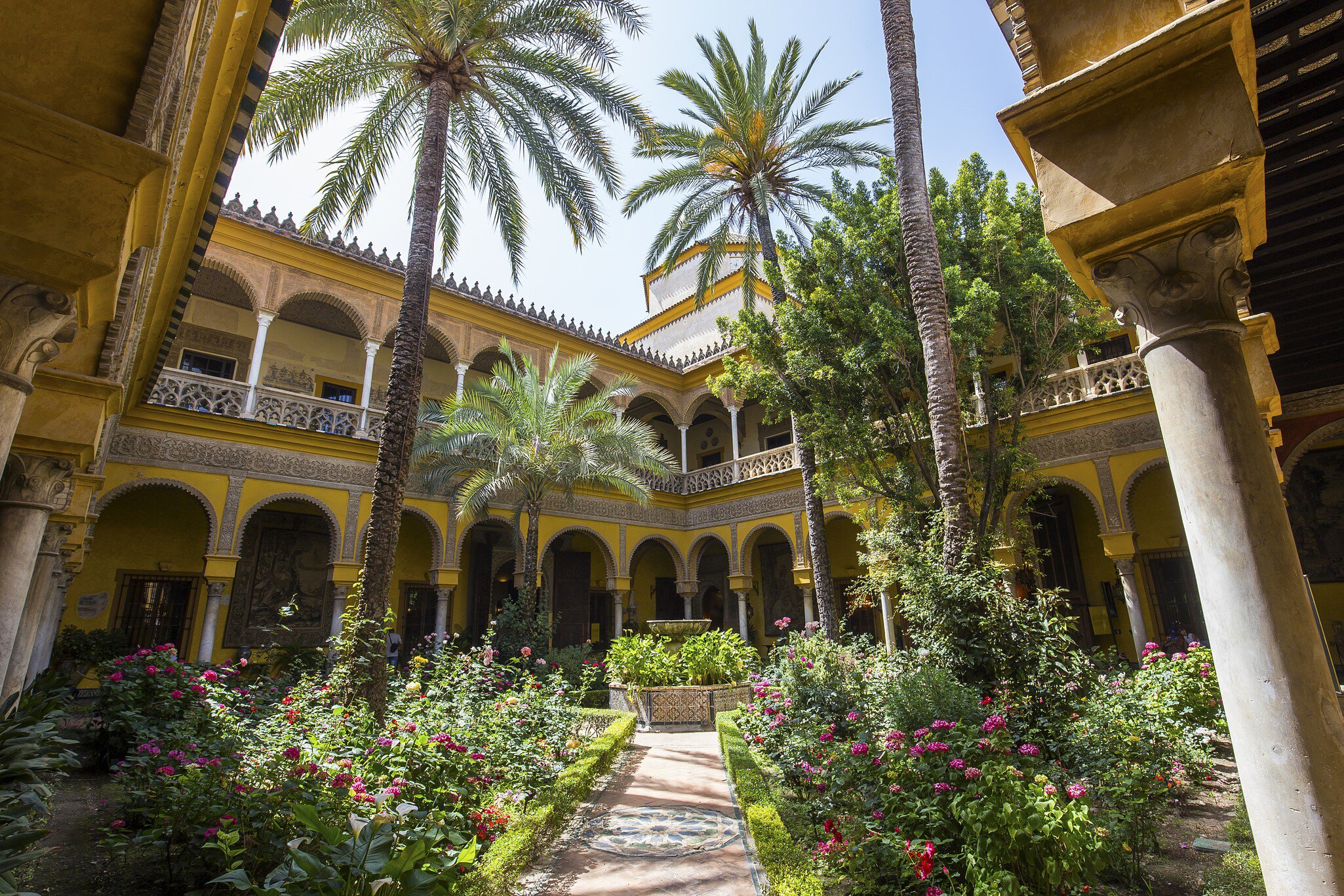 View of the courtyard of the Palacio de las Dueñas in Seville, Spain.