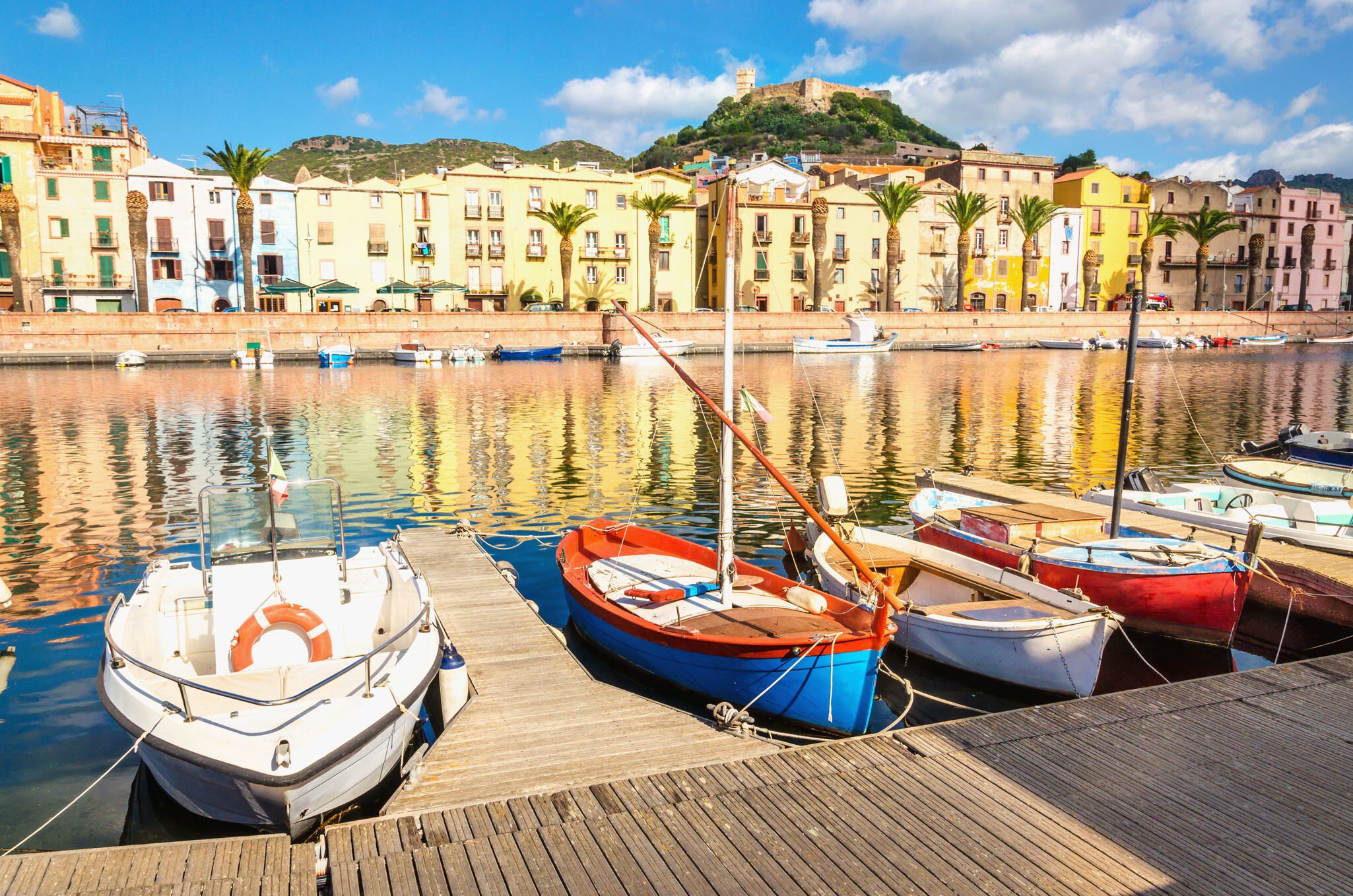 Colourful fishing boats moored on the river at Bosa.
536200936
ancient, antique, architecture, background, boat, bosa, building, castle, characteristic, city, color, colorful, europe, european, famous, history, house, island, italy, jetty, landmark, landscape, mediterranean, old, panorama, panoramic, pier, quay, reflection, river, romantic, sardegna, sardinia, scenery, sky, street, summer, sunset, temo, tourism, town, traditional, travel, urban, view, village, wallpaper, water