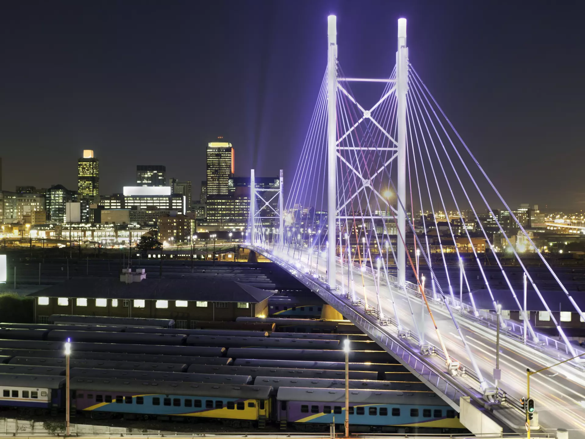 Bright lights, big city: Nelson Mandela Bridge lights up the night in Johannesburg. Henrique NDR Martins / Getty Images