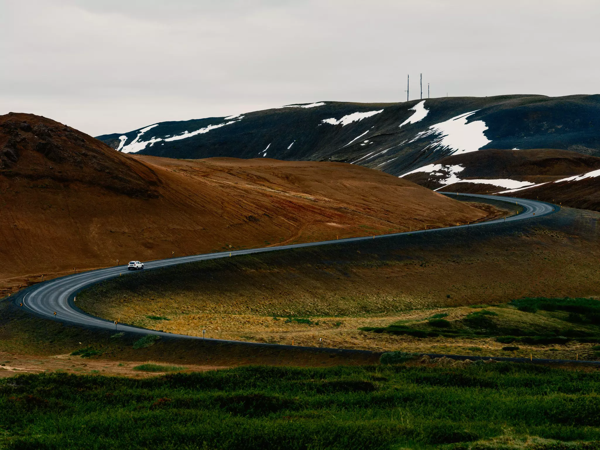 A country road weaves through a wintry landscape in Iceland. Daniel Dorsa for Lonely Planet