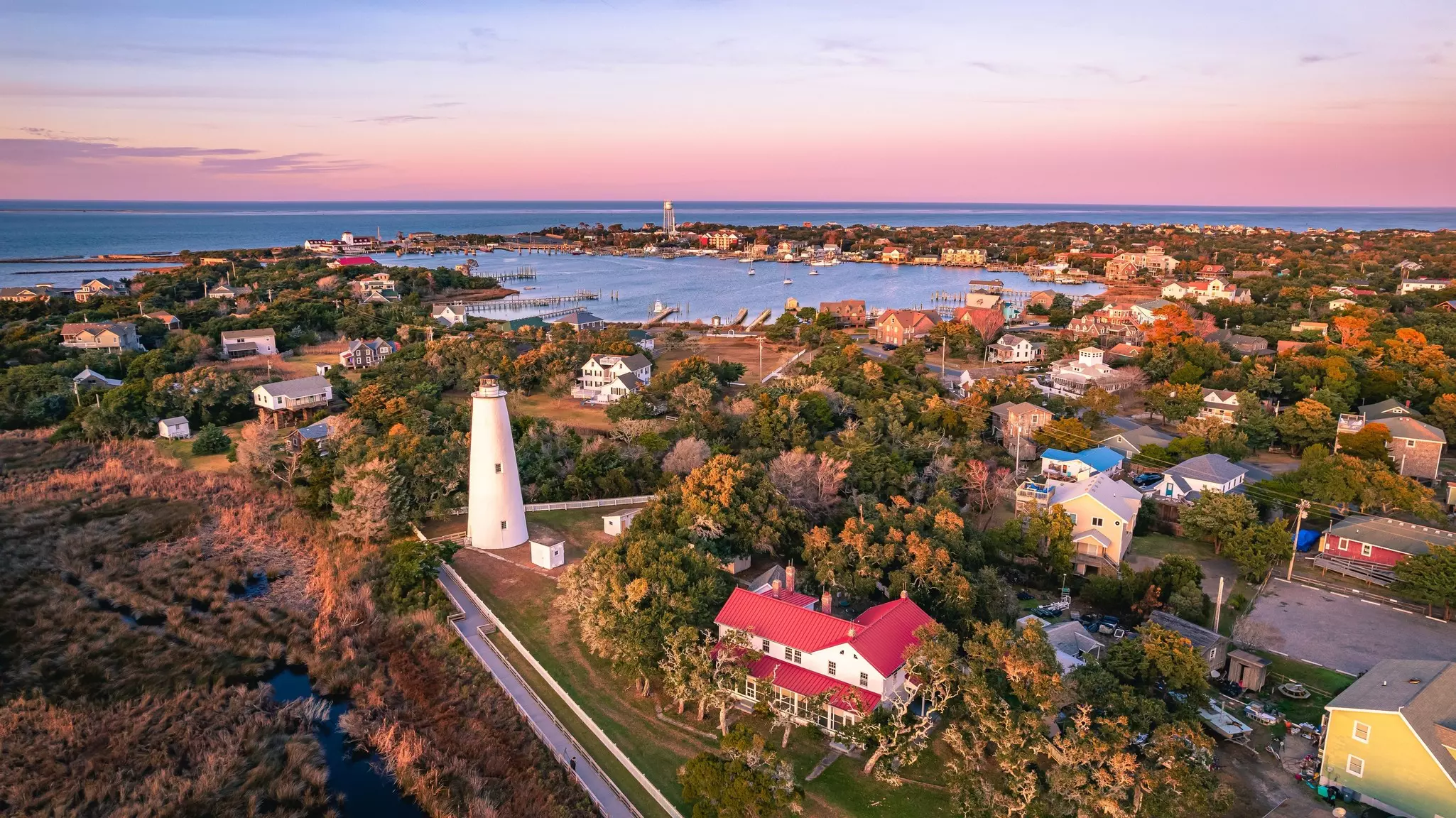 Aerial view of Ocracoke Lighthouse on Ocracoke Island, North Carolina at sunset.