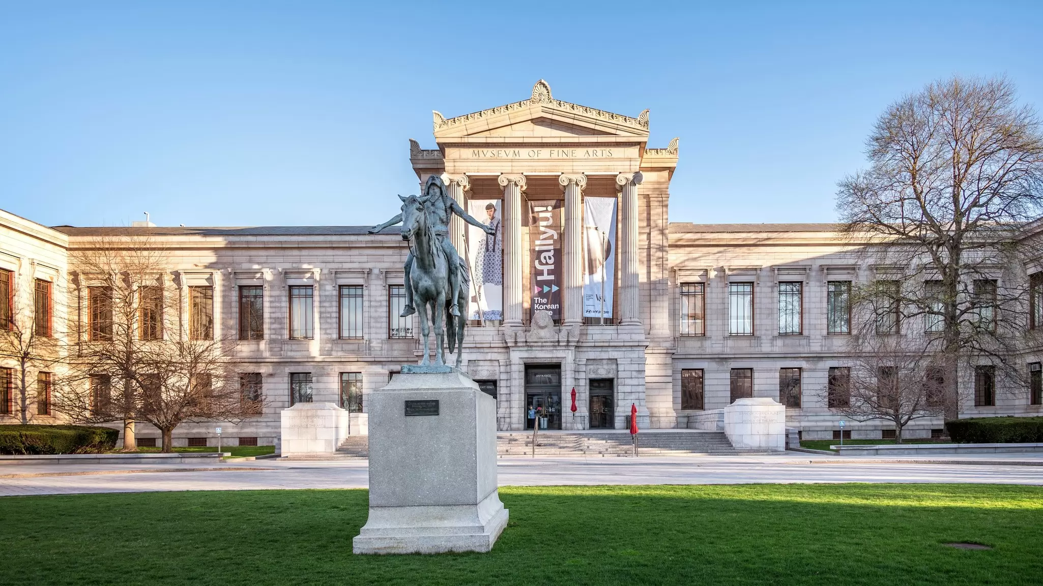 Exterior view of the Museum of Fine Arts in Boston on a sunny spring day.