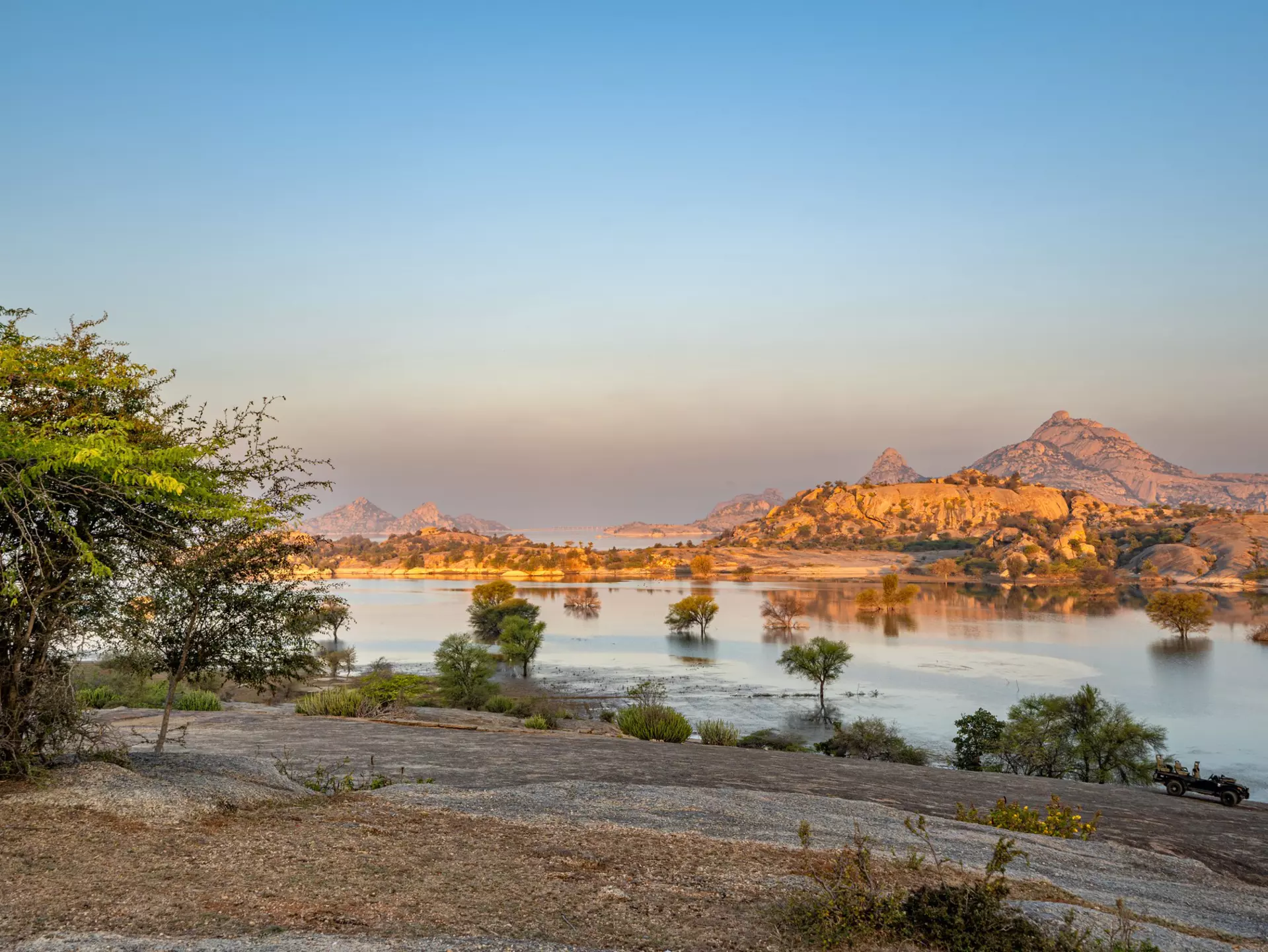 Sunrise over the dramatic boulder-covered landscape of the Jawai region in Rajasthan, India. Bkamprath/Getty Images