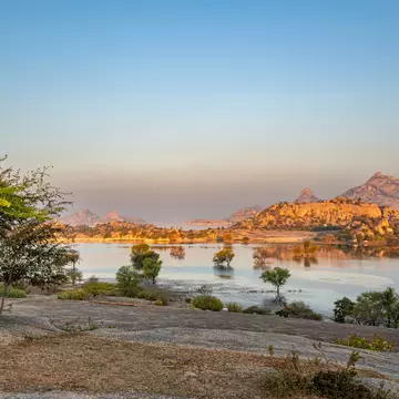 Sunrise over the dramatic boulder-covered landscape of the Jawai region in Rajasthan, India. Bkamprath/Getty Images