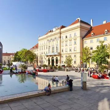VIENNA, AUSTRIA - APRIL 19: Many people enjoy a sunny afternoon at the Museumsquartier on April 19, 2011 in Vienna. It is the eighth largest cultural area in the world and a very important for Vienna; Shutterstock ID 202273378; Your name (First / ...
