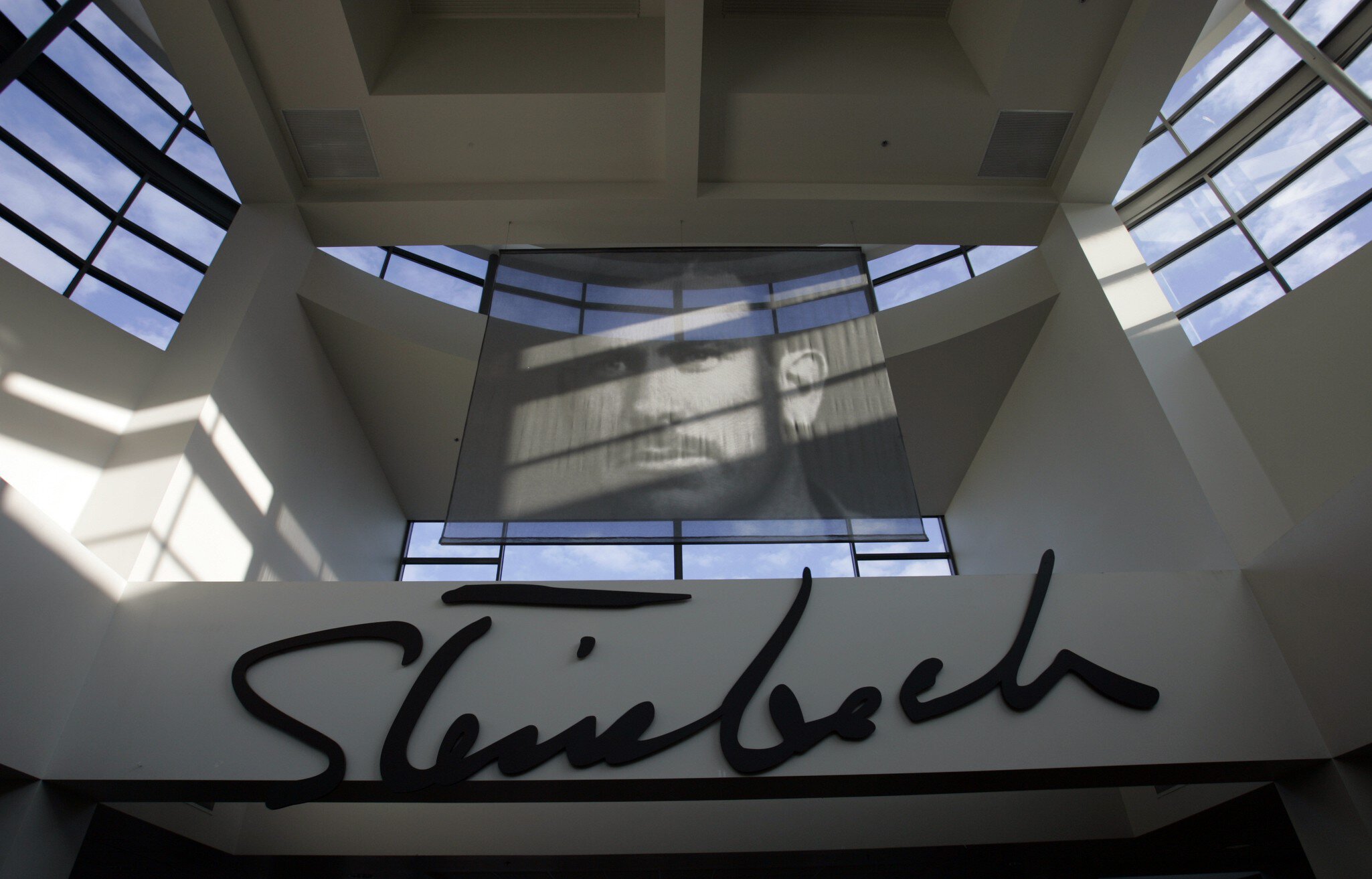 Portrait of John Steinbeck inside the lobby of the National Steinbeck Center in downtown Salinas. The spinach scare is only the latest bad news for Salinas. The biggest city in Monterey County was so broke it nearly shut its libraries two years ag...