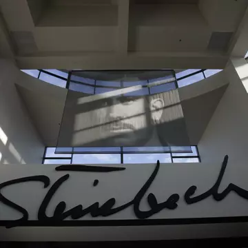 Portrait of John Steinbeck inside the lobby of the National Steinbeck Center in downtown Salinas. The spinach scare is only the latest bad news for Salinas. The biggest city in Monterey County was so broke it nearly shut its libraries two years ag...