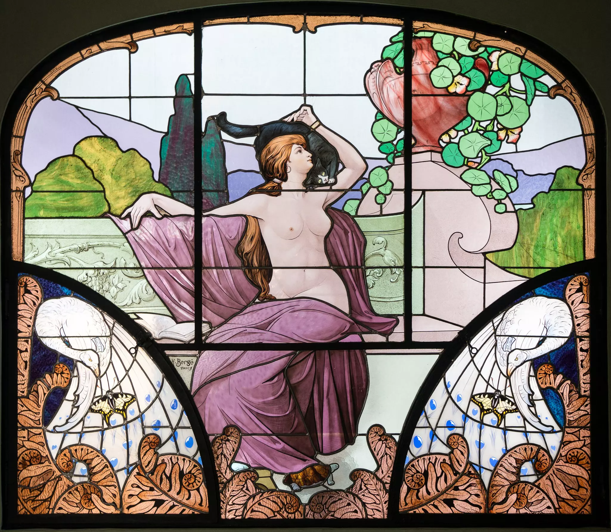 An art nouveau stained glass window in the museum of Nancy School, Nancy, Lorraine, France.