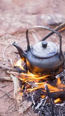 Pot of tea on a camp fire in the desert 