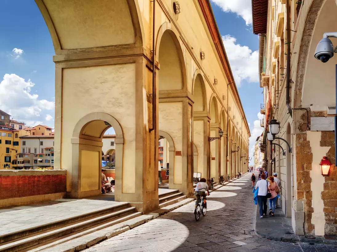 Arches of the Vasari Corridor (Corridoio Vasariano) in Florence, Tuscany, Italy. View of the Lungarno degli Archibusieri. Florence is a popular tourist destination of Europe.